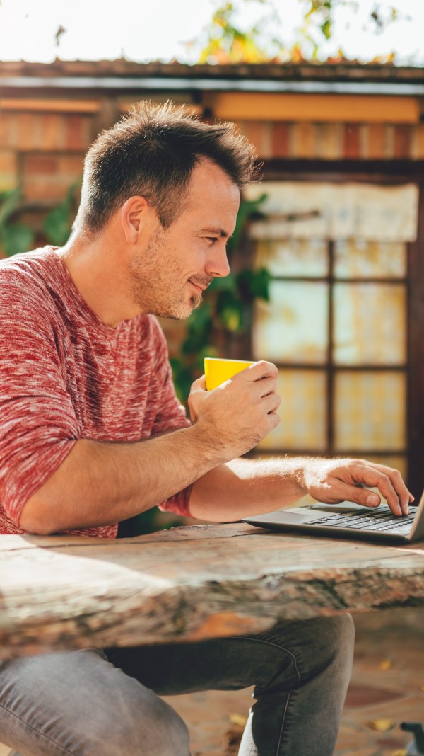 Man working outdoors with exotic background.