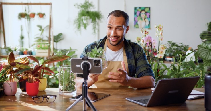 Young Black nursery owner filing content.