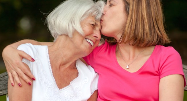 senior mother and mature daughter sharing an affectionate moment together