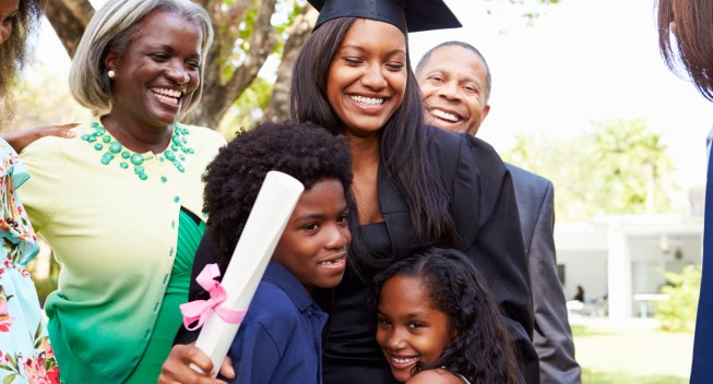 African American Student Celebrates Graduation Smiling