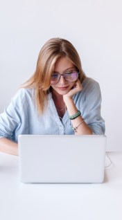 Woman filing taxes on laptop