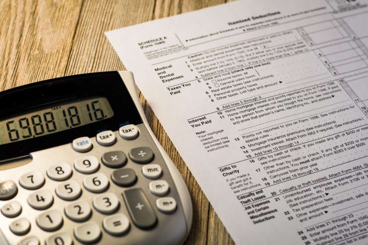 Close up of "Interest You Paid" portion of tax form and calculator.