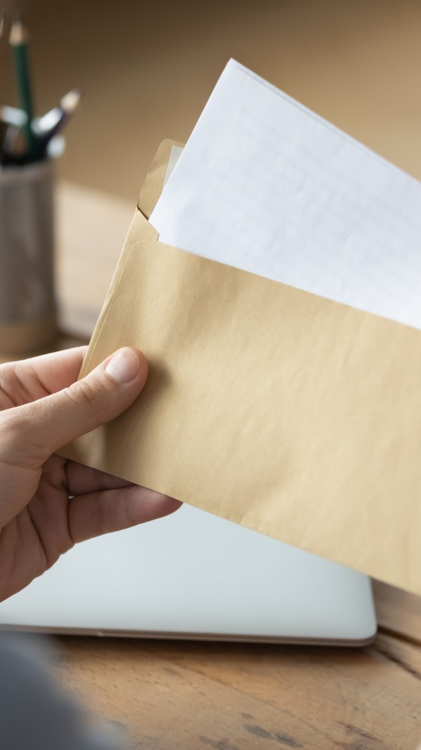 Man opening a letter