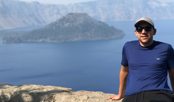 person sitting on mountain