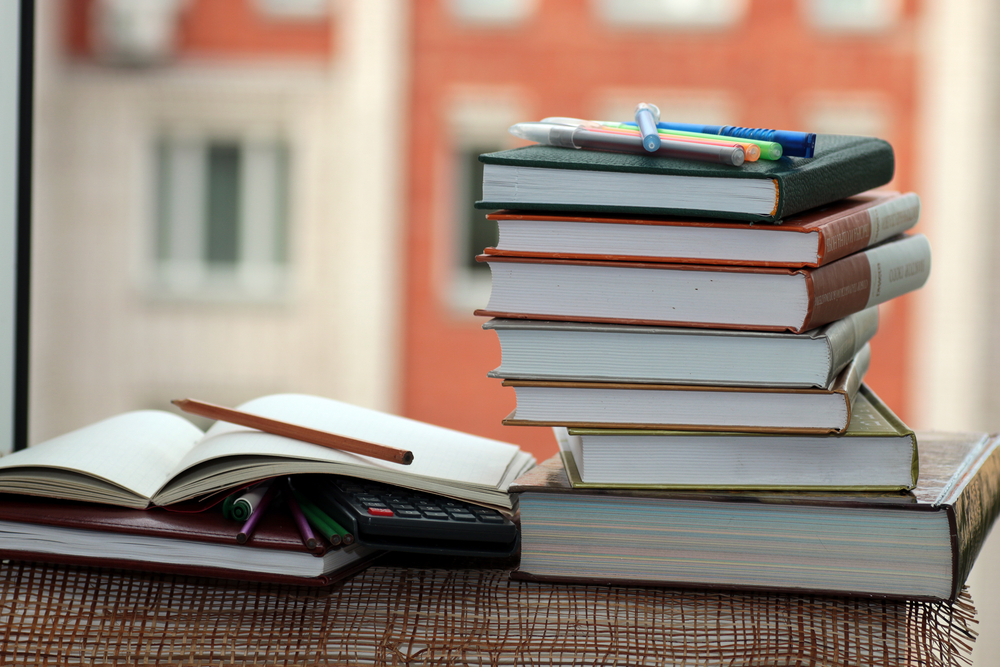 Stack of college textbooks.