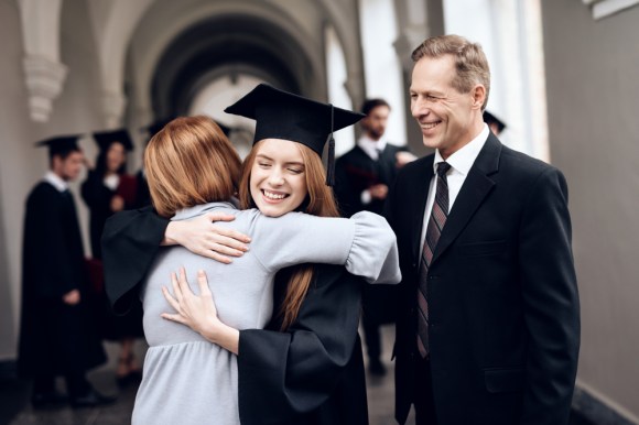 Parents with their college graduate.