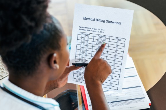 Woman reviewing a medical bill.