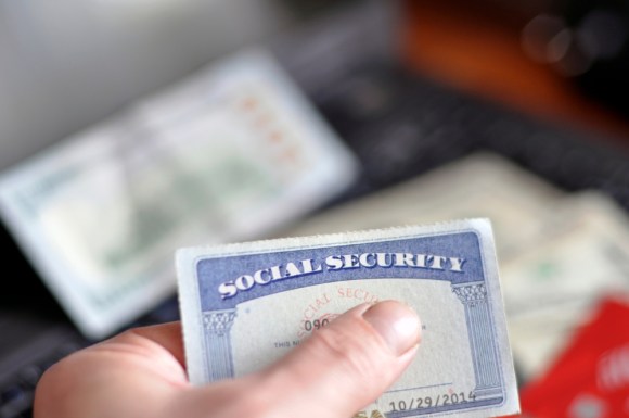 Close-up of someone holding Social Security card.