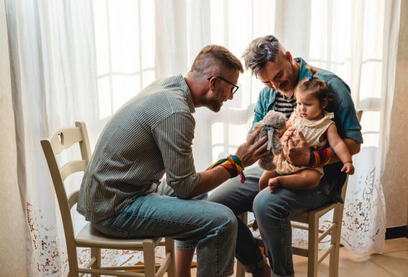 Fathers playing with their baby.