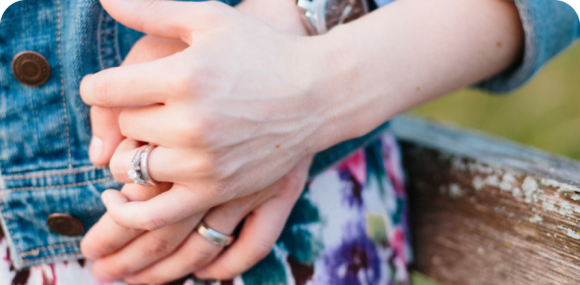 Photo of a married couple holding hands