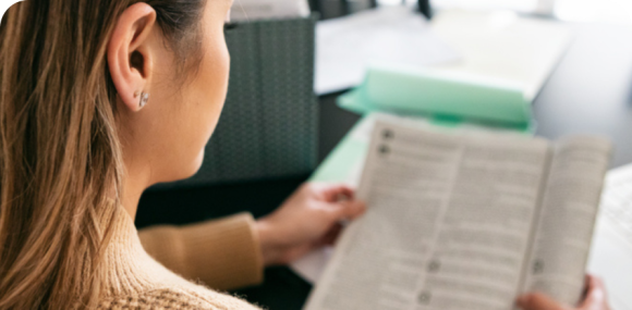 Photo of a woman reading an article