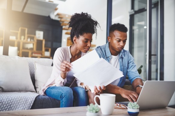 Couple working on household finances 