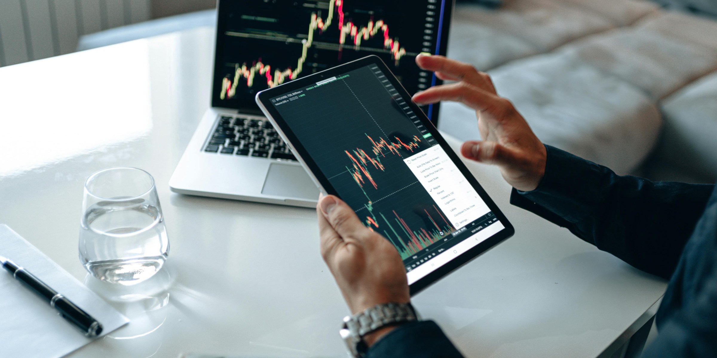 Modern investing on a laptop and tablet